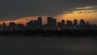 DX0003_232_015 - 5.7K stock footage aerial video passing by skyscrapers in the Downtown Tampa skyline at twilight, Florida