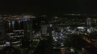 DX0003_232_036 - 5.7K aerial stock footage of slowly orbiting college at nighttime in Downtown Tampa, Florida