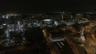 DX0003_232_041 - 5.7K aerial stock footage of an orbit of Amalie Arena at night in Downtown Tampa, Florida