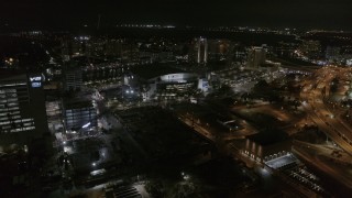 DX0003_232_044 - 5.7K aerial stock footage of slowly approaching Amalie Arena at night in Downtown Tampa, Florida