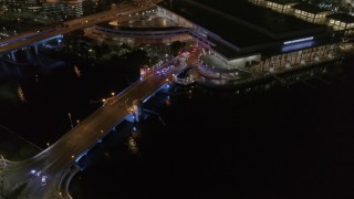 DX0003_232_052 - 5.7K aerial stock footage police cars on the bridge by convention center at night in Downtown Tampa, Florida