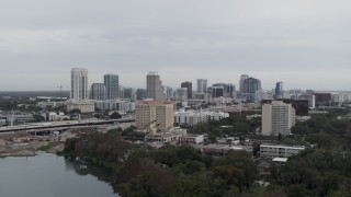 DX0003_233_001 - 5.7K aerial stock footage of ascending toward the city's skyline, Downtown Orlando, Florida