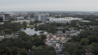 DX0003_233_016 - 5.7K aerial stock footage of Lake Dot and apartment buildings in Orlando, Florida