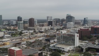 DX0003_233_032 - 5.7K aerial stock footage a view of the city's skyline from a nearby hotel, Downtown Orlando, Florida