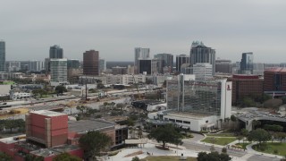 DX0003_233_034 - 5.7K aerial stock footage approach the city's skyline from a nearby hotel, Downtown Orlando, Florida