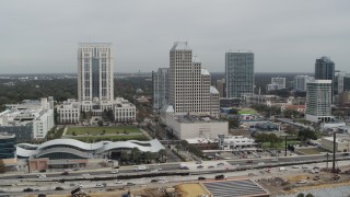 DX0003_233_037 - 5.7K aerial stock footage slowly fly away from Bank of America Center in Downtown Orlando, Florida
