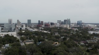 DX0003_233_049 - 5.7K aerial stock footage ascending past the city's skyline, Downtown Orlando, Florida