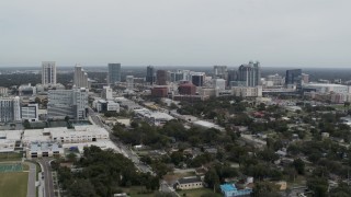 DX0003_233_052 - 5.7K aerial stock footage of flying by the skyline of Downtown Orlando, Florida