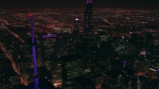 ED0001_000016 - HD stock footage aerial video tilt from Trump Tower skyscraper to reveal Willis Tower at night in Downtown Chicago, Illinois