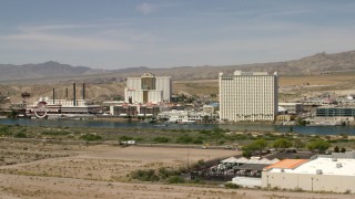 FG0001_000002 - 4K aerial stock footage of desert hotels and casinos across the Colorado River in Laughlin, Nevada