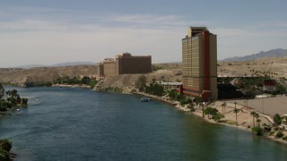 FG0001_000006 - 4K aerial stock footage follow the Colorado River past resort casinos in Laughlin, Nevada