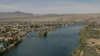 FG0001_000012 - 4K aerial stock footage of apartment buildings and homes on the Colorado River in Bullhead City, Arizona