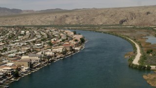 FG0001_000015 - 4K aerial stock footage of waterfront houses and docks on the Colorado River in Bullhead City, Arizona