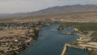 FG0001_000018 - 4K aerial stock footage of homes with docks on the Colorado River in Bullhead City, Arizona