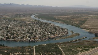 FG0001_000022 - 4K aerial stock footage of waterfront neighborhood on the Colorado River in Bullhead City, Arizona