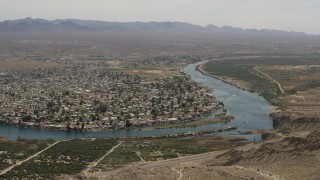 FG0001_000023 - 4K aerial stock footage of riverfront neighborhood on the Colorado River in Bullhead City, Arizona