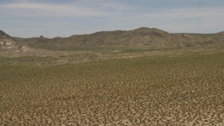 FG0001_000026 - 4K aerial stock footage fly over Mojave Desert to approach Dead Mountains Wilderness Area in California