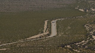 FG0001_000033 - 4K aerial stock footage of bus and cars traveling on a Mojave Desert highway in Laughlin, Nevada