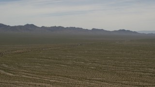 FG0001_000036 - 4K aerial stock footage of distant mountains and wide open Mojave Desert near Laughlin, Nevada