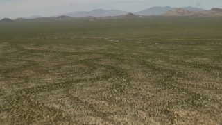 FG0001_000039 - 4K aerial stock footage fly over a wide Mojave Desert landscape in San Bernardino County, California