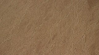 FG0001_000069 - 4K stock footage aerial video of a bird's eye view of a flat Mojave Desert plain in San Bernardino County, California