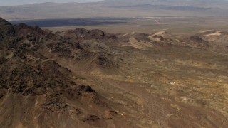 FG0001_000079 - 4K stock footage aerial video of the Pisgah Crater behind rugged Mojave Desert mountains in San Bernardino County, California