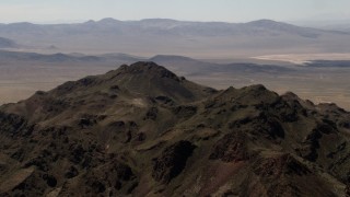 FG0001_000082 - 4K stock footage aerial video of the rugged summit of a Mojave Desert mountain in San Bernardino County, California