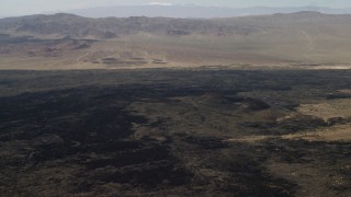 FG0001_000087 - 4K aerial stock footage pan across the lava fields around Pisgah Crater in Mojave Desert, San Bernardino County, California