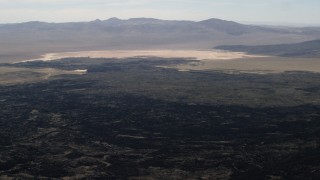 FG0001_000089 - 4K aerial stock footage pan across the lava fields of the Pisgah Crater in the Mojave Desert, San Bernardino County, California