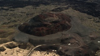 FG0001_000093 - 4K stock footage aerial video of a reverse view of the Pisgah Crater cinder cone in the Mojave Desert, San Bernardino County, California