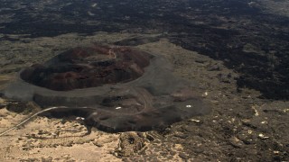 FG0001_000094 - 4K aerial stock footage fly away from the Pisgah Crater cinder cone and lava field in the Mojave Desert, San Bernardino County, California