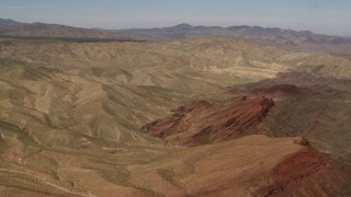 FG0001_000099 - 4K aerial stock footage of passing the Rodman Mountains and colorful striations in the Mojave Desert, San Bernardino County, California