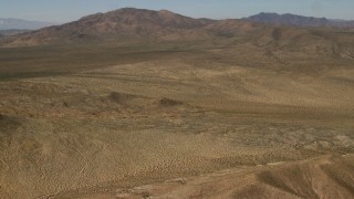 FG0001_000102 - 4K aerial stock footage pan across the Rodman Mountains and desert plain in the Mojave Desert, San Bernardino County, California