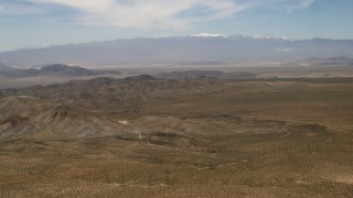 FG0001_000105 - 4K aerial stock footage pan across Iron Ridge in the Mojave Desert, San Bernardino County, California
