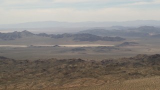 FG0001_000111 - 4K aerial stock footage of Iron Ridge mountains and desert ridges in the background in the Mojave Desert, San Bernardino County, California
