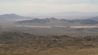 FG0001_000112 - 4K aerial stock footage wide view of Iron Ridge mountains and distant desert ridges in the Mojave Desert, San Bernardino County, California
