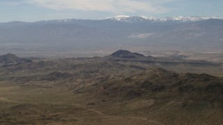 FG0001_000118 - 4K aerial stock footage of San Bernardino Mountains and Mojave Desert mountains, San Bernardino County, California