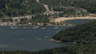 FG0001_000132 - 4K aerial stock footage of watercraft near the marina and the beach on Silverwood Lake, California