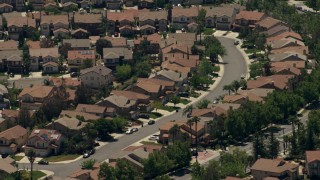 FG0001_000141 - 4K aerial stock footage of a suburban neighborhood with tract homes in Rancho Cucamonga, California