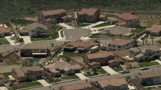 FG0001_000143 - 4K aerial stock footage of large tract homes in a residential neighborhood, Rancho Cucamonga, California