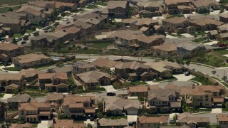FG0001_000147 - 4K aerial stock footage of large homes in a suburban residential neighborhood in Rancho Cucamonga, California