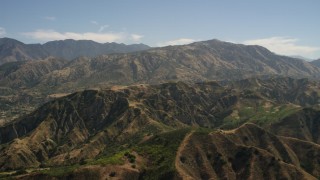FG0001_000154 - 4K aerial stock footage of approaching a mountain ridge and peak in the San Gabriel Mountains, California