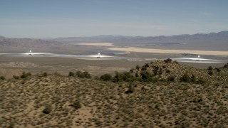 FG0001_000164 - 4K aerial stock footage of towers and arrays of the Ivanpah Solar Electric Generating System, California