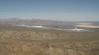 FG0001_000167 - 4K aerial stock footage tilt from blue skies to reveal the Ivanpah Solar Electric Generating System, California