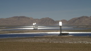 FG0001_000182 - 4K aerial stock footage flyby the towers and mirrors of the Ivanpah Solar Electric Generating System in California