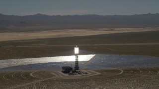 FG0001_000188 - 4K aerial stock footage of orbiting one of the arrays at the Ivanpah Solar Electric Generating System in California