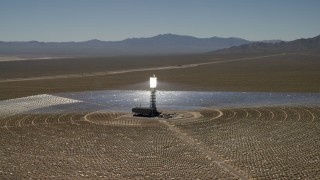 FG0001_000190 - 4K aerial stock footage of an orbit around one of the arrays at the Ivanpah Solar Electric Generating System in California