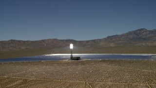 FG0001_000193 - 4K aerial stock footage tilt to reveal and orbit an array at the Ivanpah Solar Electric Generating System in California