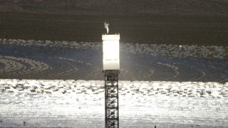 FG0001_000200 - 4K aerial stock footage of a boiler atop a power tower at the Ivanpah Solar Electric Generating System in California