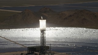 FG0001_000203 - 4K aerial stock footage zoom wider from a clope-up of a power tower boiler at the Ivanpah Solar Electric Generating System in California